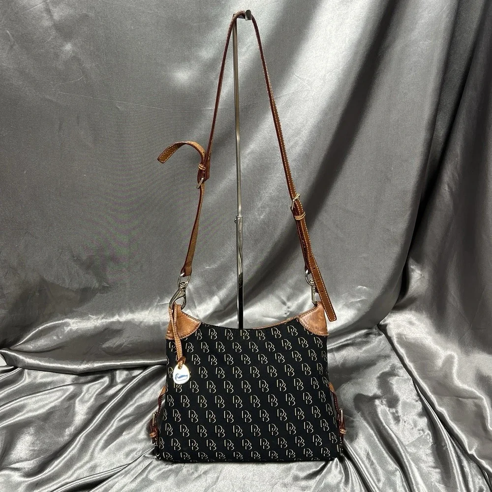 Dooney & Bourke‎ DB Monogram Canvas Hobo Shoulder Bag Black Leather Duck Charm